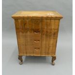 An Anglo-Indian carved chest of drawers. 51 cm wide.