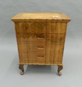 An Anglo-Indian carved chest of drawers. 51 cm wide.