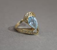 A 14 K gold aquamarine ring. Ring Size P.