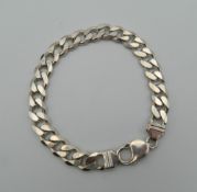 A silver curb bracelet. 21 cm long. 31.4 grammes.