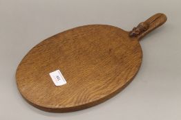 A Mouseman cheeseboard. 39.5 cm long.