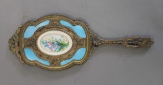 A French Palais-Royal hand mirror set with a miniature painting. 28 cm high.