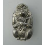 A vesta in the form of a monkey. 6 cm high.