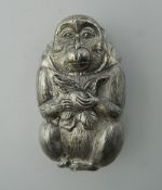 A vesta in the form of a monkey. 6 cm high.