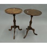 Two mahogany side tables. Each 64 cm high.