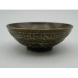A small Chinese bronze bowl. 6 cm diameter.