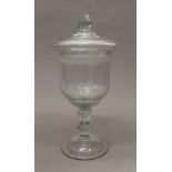 A 19th century cut glass urn and cover. 38.5 cm high.
