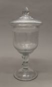 A 19th century cut glass urn and cover. 38.5 cm high.