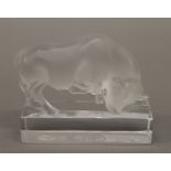 A Lalique glass model of a bull. 11 cm wide.