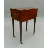 A 19th century mahogany Pembroke worktable. 34 cm wide closed.