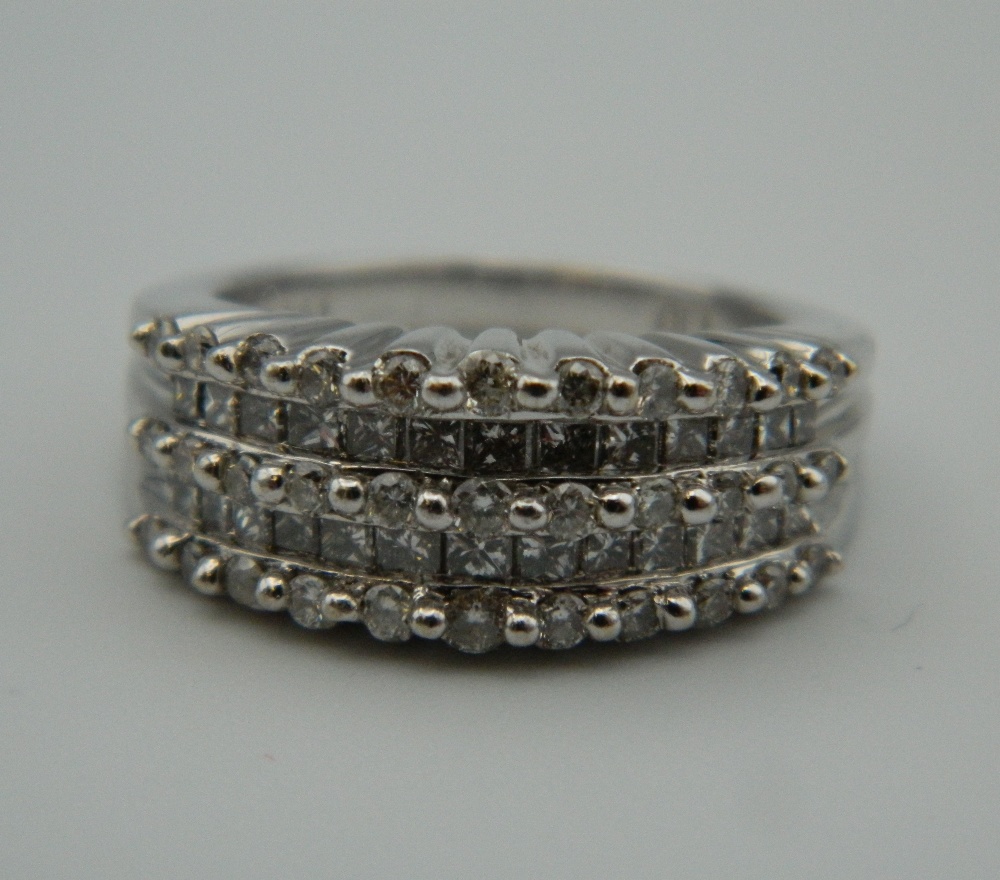 A 14 ct white gold brilliant cut and princess cut diamond band. Total weight of the diamonds 1. - Image 7 of 8