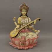 A resin model of a multi-armed deity. 37 cm high.