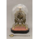 A Victorian double fusee brass skeleton clock, under glass dome. 41 cm high.