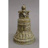 A bronze bell decorated with putti. 12.5 cm high.