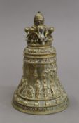 A bronze bell decorated with putti. 12.5 cm high.