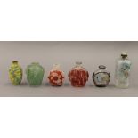 A collection of Chinese snuff bottles. The largest 9.5 cm high.