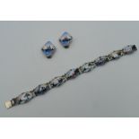 A Norwegian silver and enamel bracelet, together with a matching pair of ear clips. The former 17.