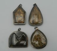 Four Eastern icon pendants. The largest 7.5 cm high.