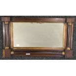 A Regency gilt heightened rosewood over mantle mirror. 67 cm wide.