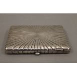 A Russian silver starburst cigarette case. 11.5 cm wide. 8 troy ounces.