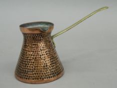 An early 19th century Dinanderie copper chocolate warmer,