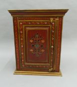 An Indian painted wall cabinet. 51.5 cm wide, 64 cm high, 25.5 cm deep.