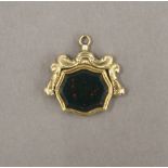 A 9 ct gold spinning bloodstone fob. 2 cm wide. 4.9 grammes total weight.