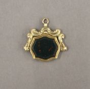 A 9 ct gold spinning bloodstone fob. 2 cm wide. 4.9 grammes total weight.