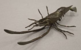 A bronze model of a shrimp. 14 cm long.