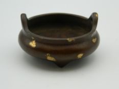 A small Chinese bronze gold splash censer. 6 cm diameter.