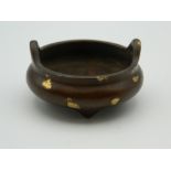 A small Chinese bronze gold splash censer. 6 cm diameter.