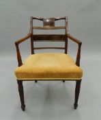 A 19th century mahogany open armchair. 55 cm wide.