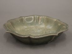 A Chinese celadon bowl. 18.