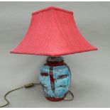 A Poole pottery lamp. 50 cm high overall.