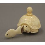 A bone tortoise tape measure. 3.5 cm high.