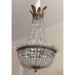 An early 20th century, probably French cut glass chandelier. 98 cm high x 63 cm diameter.