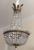 An early 20th century, probably French cut glass chandelier. 98 cm high x 63 cm diameter.