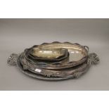 A quantity of silver plated trays. The largest 65 cm long.