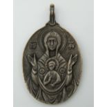 An icon formed pendant, bearing Russian marks. 5 cm high.