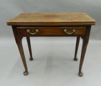 A George III mahogany pad foot tea table. 81 cm wide.