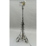 An early 20th century wrought iron and brass standard lamp. 163 cm high.