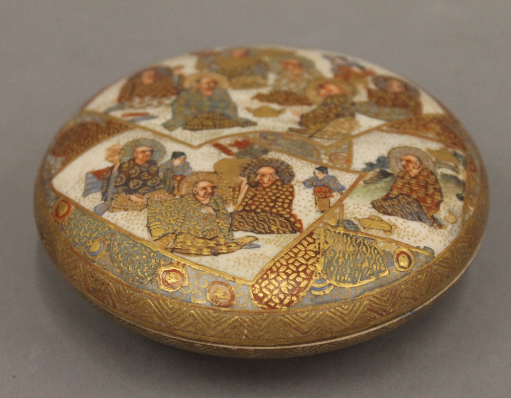 A Satsuma round box with internal decoration. 9.5 cm diameter.