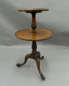 An early 20th century mahogany two-tier dumb waiter. 102 cm high.