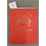 A Stanley Gibbons stamp album containing a large collection of George VI stamps,