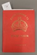 A Stanley Gibbons stamp album containing a large collection of George VI stamps,