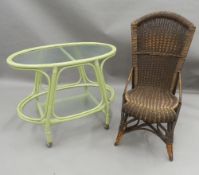 An oval glass green painted two-tier tea trolley and a wicker chair. The former 80 cm long.