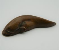 A bronze model of a catfish. 5.5 cm long.