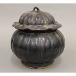 A Chinese brown glazed lidded tureen formed as a pumpkin. 22 cm high.