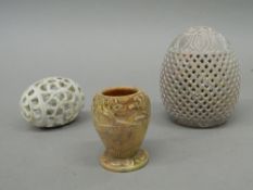 Three carved soapstone pieces. The largest 10 cm high.