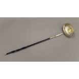 A Georgian coin set unmarked silver baleen toddy ladle. 37 cm long.